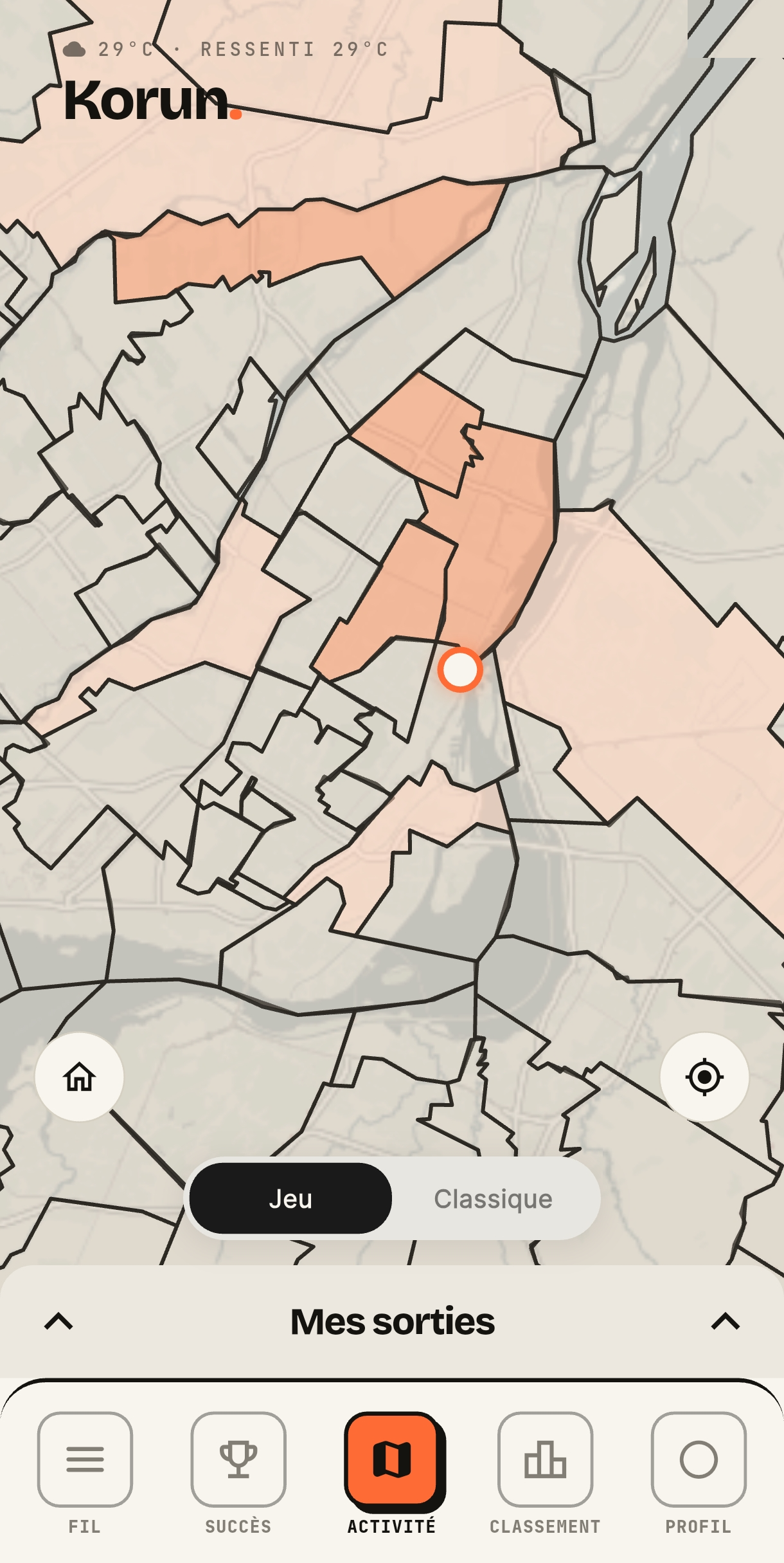 Carte de conquête de Korun : les quartiers de Montréal délimités en noir sur fond « bitume » clair, ceux déjà conquis teintés d'orange, avec la position du coureur au centre.